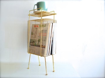 a wire magazine rack looks cool and can be used for props